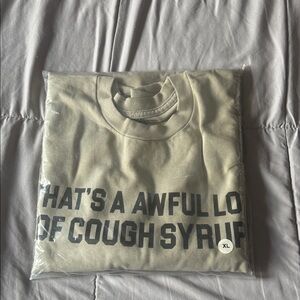 Beige Graphic L/S Tee that says "That's A Awful Lot Of Cough Syrup"